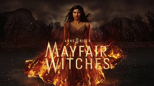 Eine Frau in einem brennenden Kleid steht vor einem dunklen Hintergrund. Der Titel „Anne Rice's Mayfair Witches“ ist sichtbar.