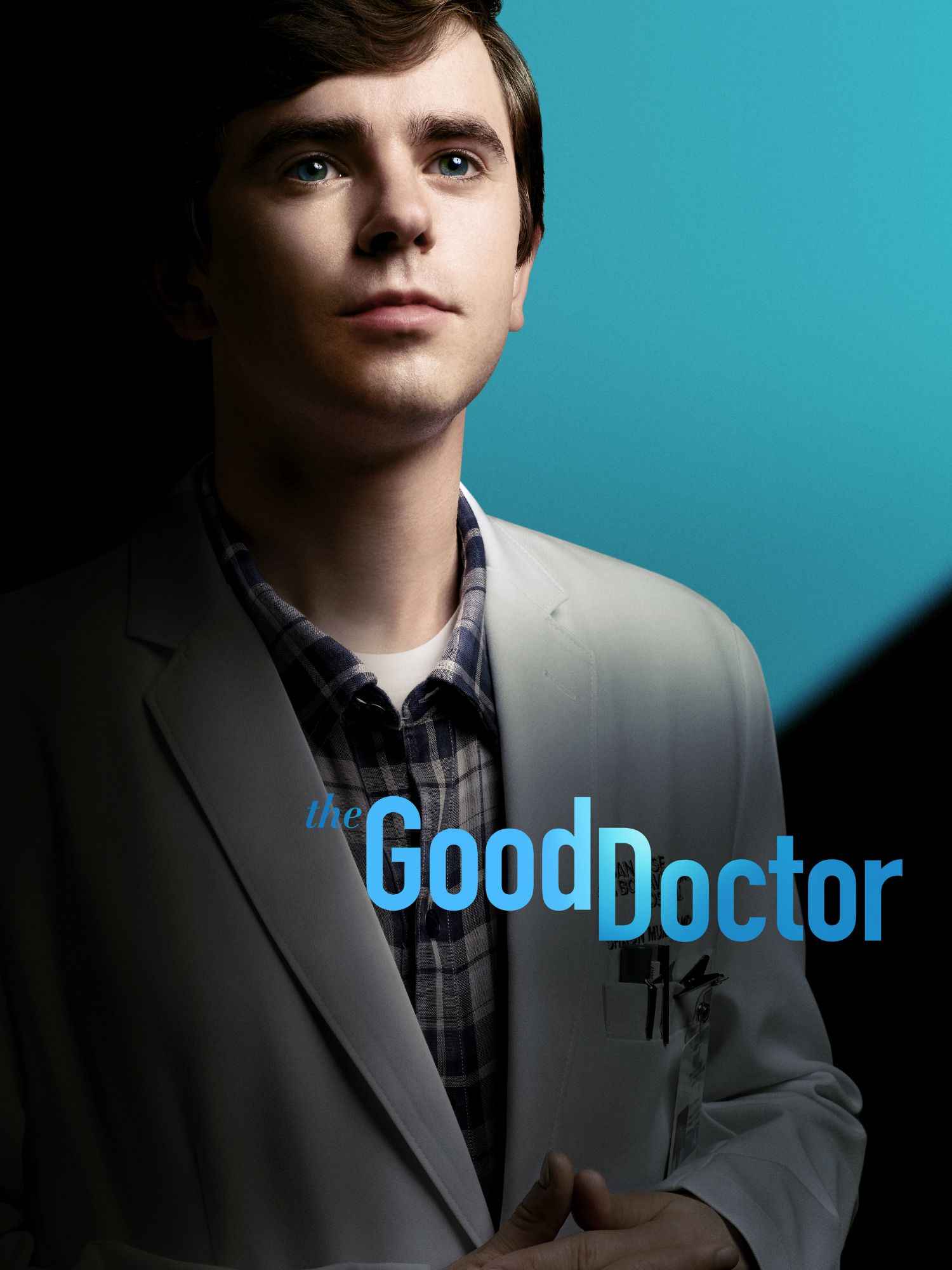 Plakat zur Serie „The Good Doctor“ mit einem jungen Arzt in weißem Kittel vor einem zweigeteilten Hintergrund in Dunkel und Türkisblau, der hoffnungsvoll in die Ferne blickt.